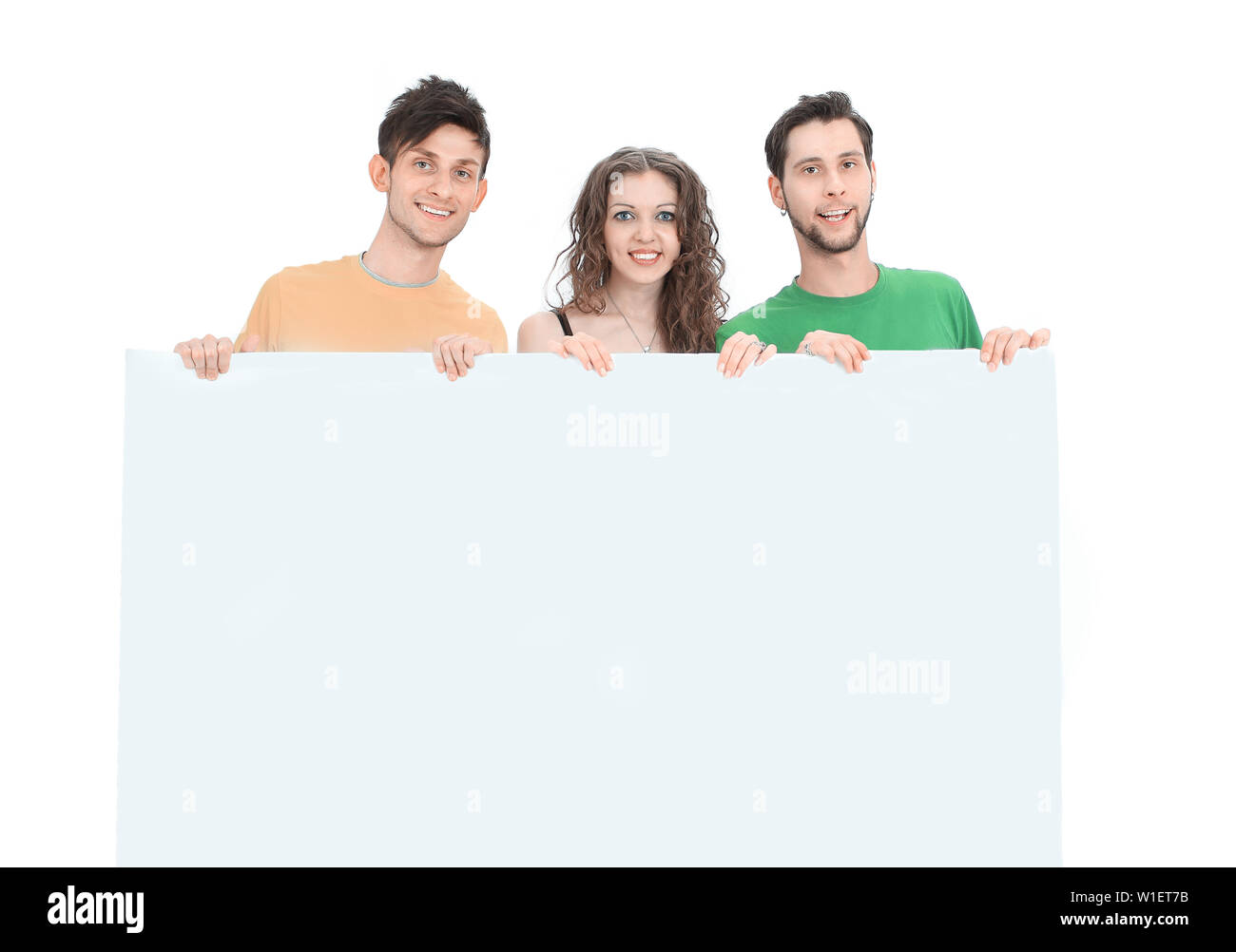 group of young people holding a large blank poster .isolated on a white ...