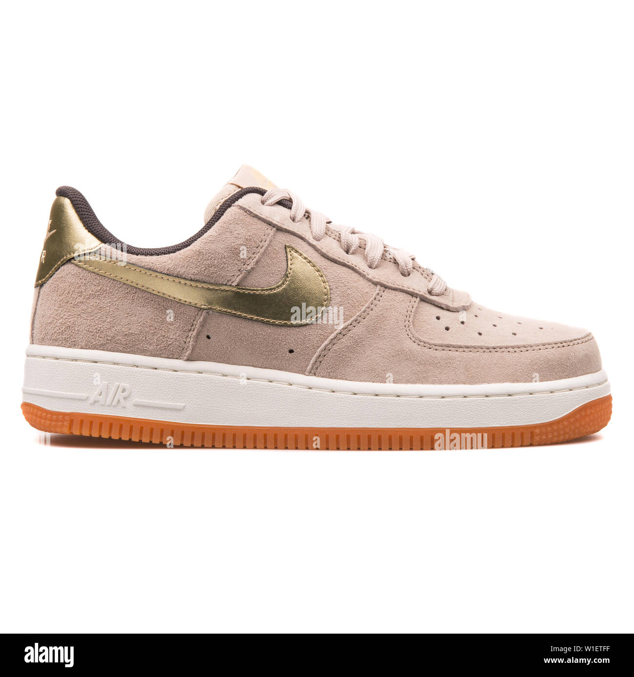 VIENNA, AUSTRIA - AUGUST 10, 2017: Nike Air Force 1 07 Premium Suede beige  and gold sneaker on white background Stock Photo - Alamy