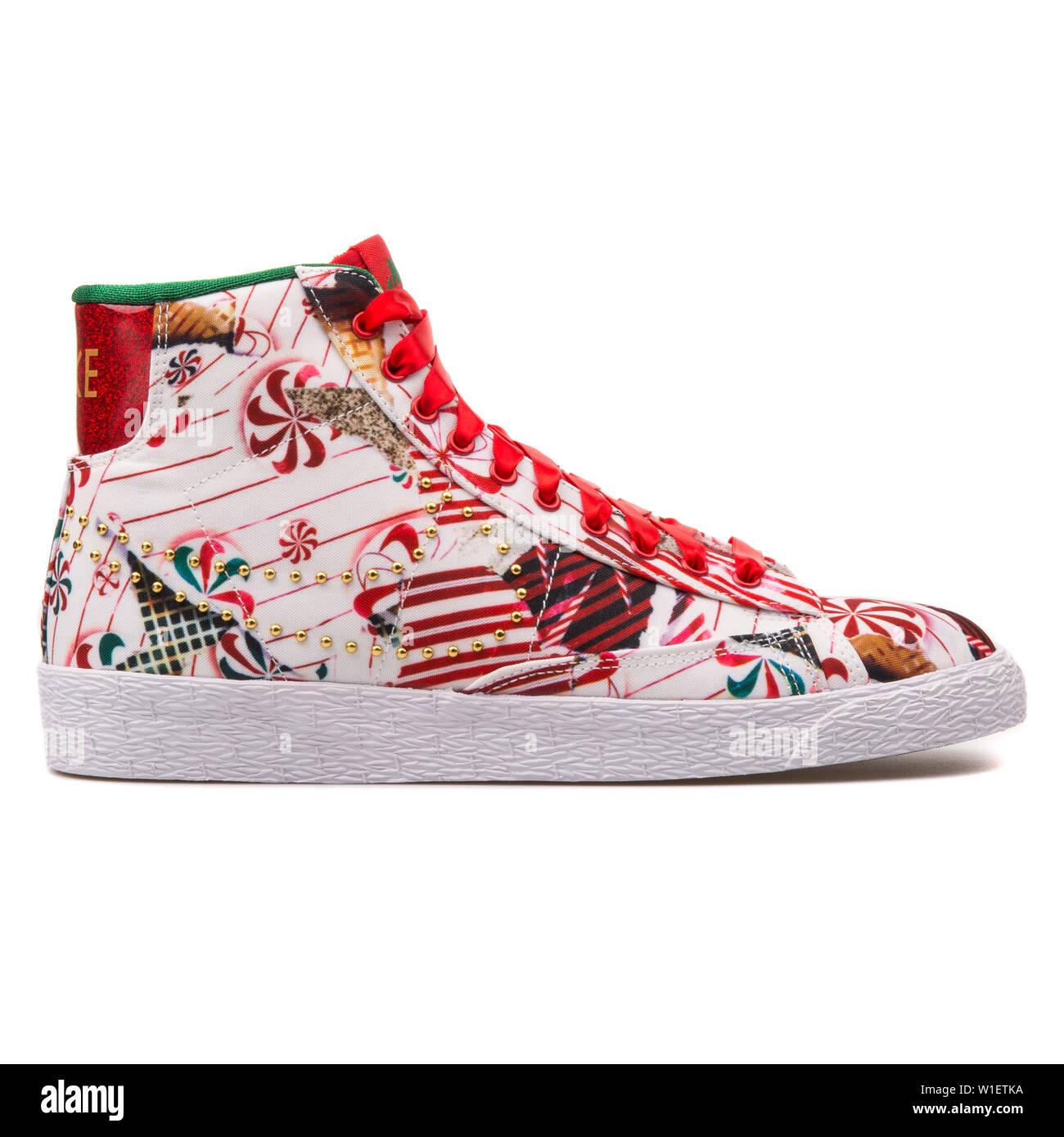 VIENNA, AUSTRIA - AUGUST 10, 2017: Nike Blazer Mid QS red, white and gold  sneaker on white background Stock Photo - Alamy