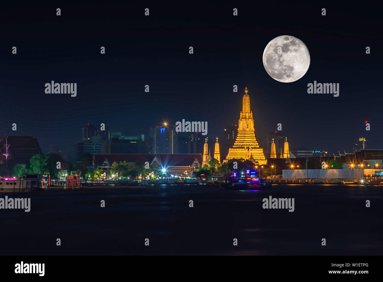 Wat Arun At Night With Light Gold Is The Oldest Temple Of The Chao Phraya River And Full Moon In The Dark Sky In Bangkok Thailand Stock Photo Alamy