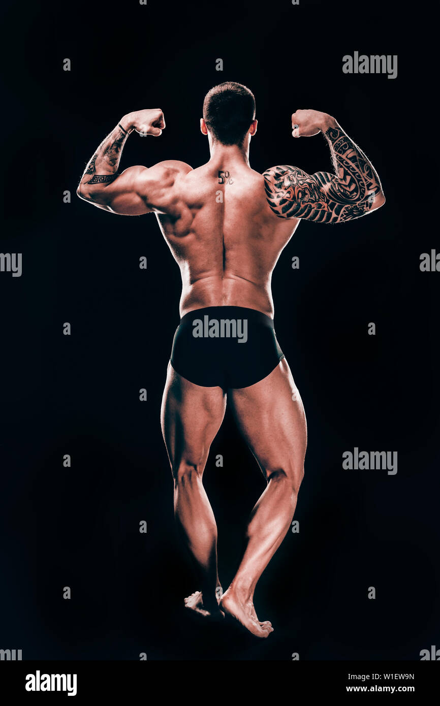 rear view. male bodybuilder showing his beautiful body.isolated on ...