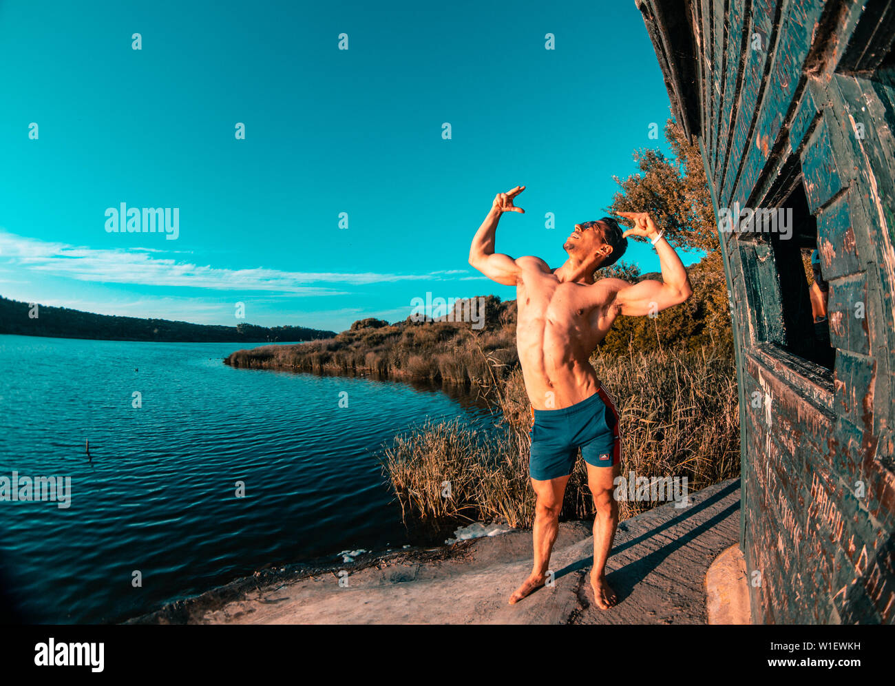 male model posing in nature fit and bodybuilding model . crossfit outside gym Stock Photo -