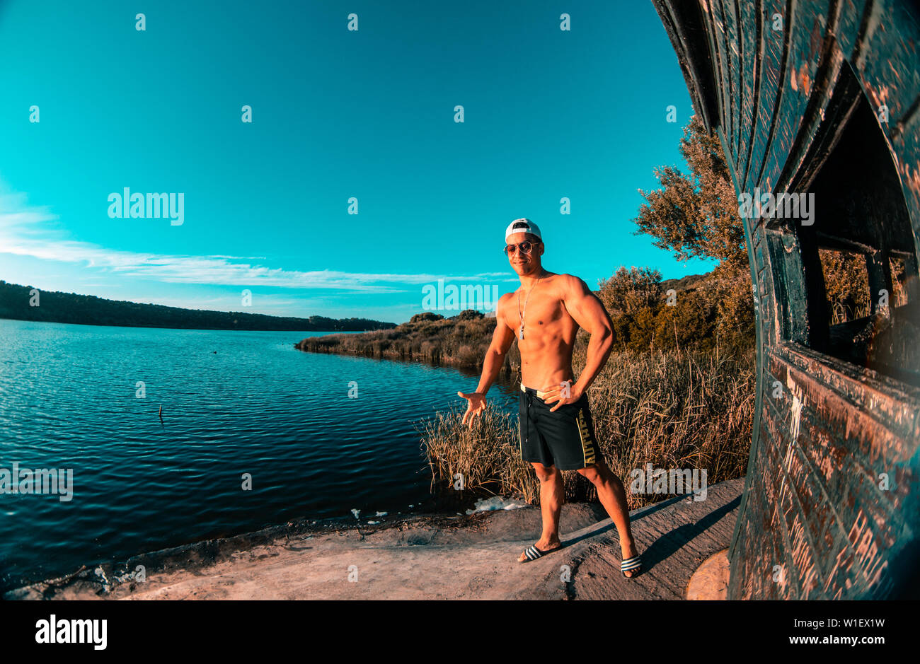 male model posing in nature , fit and bodybuilding model . crossfit outside gym . Stock Photo