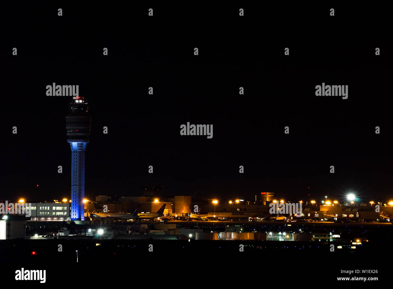 Atlanta, GA / USA : 27. May, 2015 - nightime view of the Atlanta international airport with air traffic control and streaks of planes taking off over Stock Photo