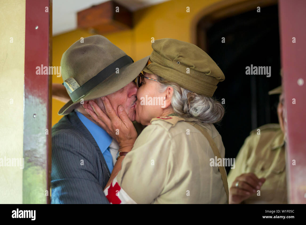 Kidderminster, UK. 29th June, 2019. Severn Valley Railways 'Step back to the 1940's' gets off to a fabulous start this weekend with costumed re-enactors playing their part in providing an authentic recreation of wartime Britain. Role-play of long lost friends in vintage clothing reunited on board the steam train, kissing inside a vintage railway carriage, believing the lyrics of Dame Vera Lynn 'We'll Meet Again'. Credit: Lee Hudson Stock Photo