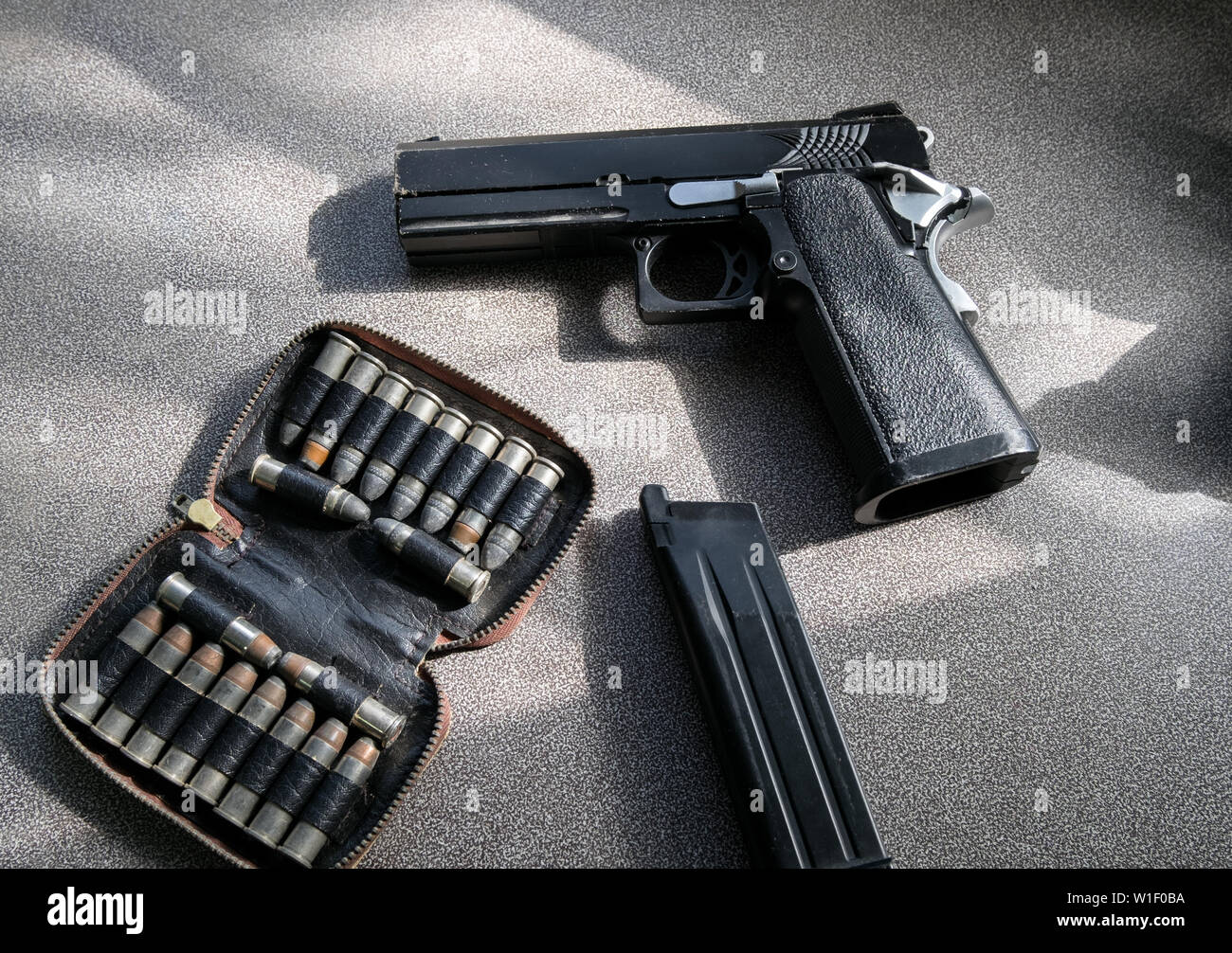 Pistol model magazine with bullets in bag on table Stock Photo Alamy