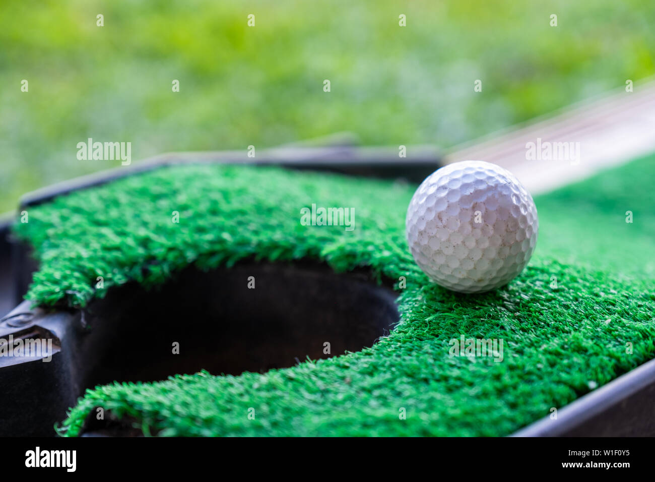 Golf ball on edge hole hires stock photography and images Alamy