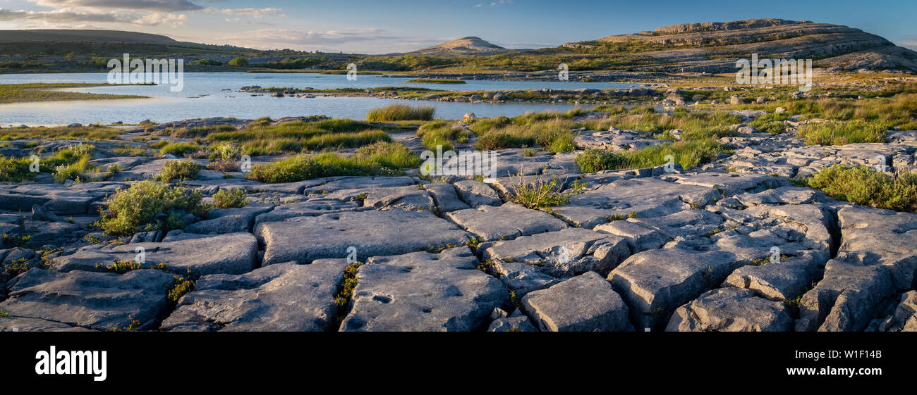 A panorama of the stunning and mars like landscape that is The Burren National Park, County Clare, Ireland at dusk, nobody in the image Stock Photo