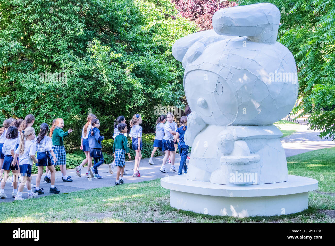 Regents Park, London, UK. 2nd July 2019. School children pause to look at a work - Tom Sachs, My Melody (2008), Presented by Galerie Thaddaeus Ropac - Frieze Sculpture, one of the largest outdoor exhibitions in London, including work by 25 international artists from across five continents in Regent’s Park from 4th July - 7th October 2019. Credit: Guy Bell/Alamy Live News Stock Photo