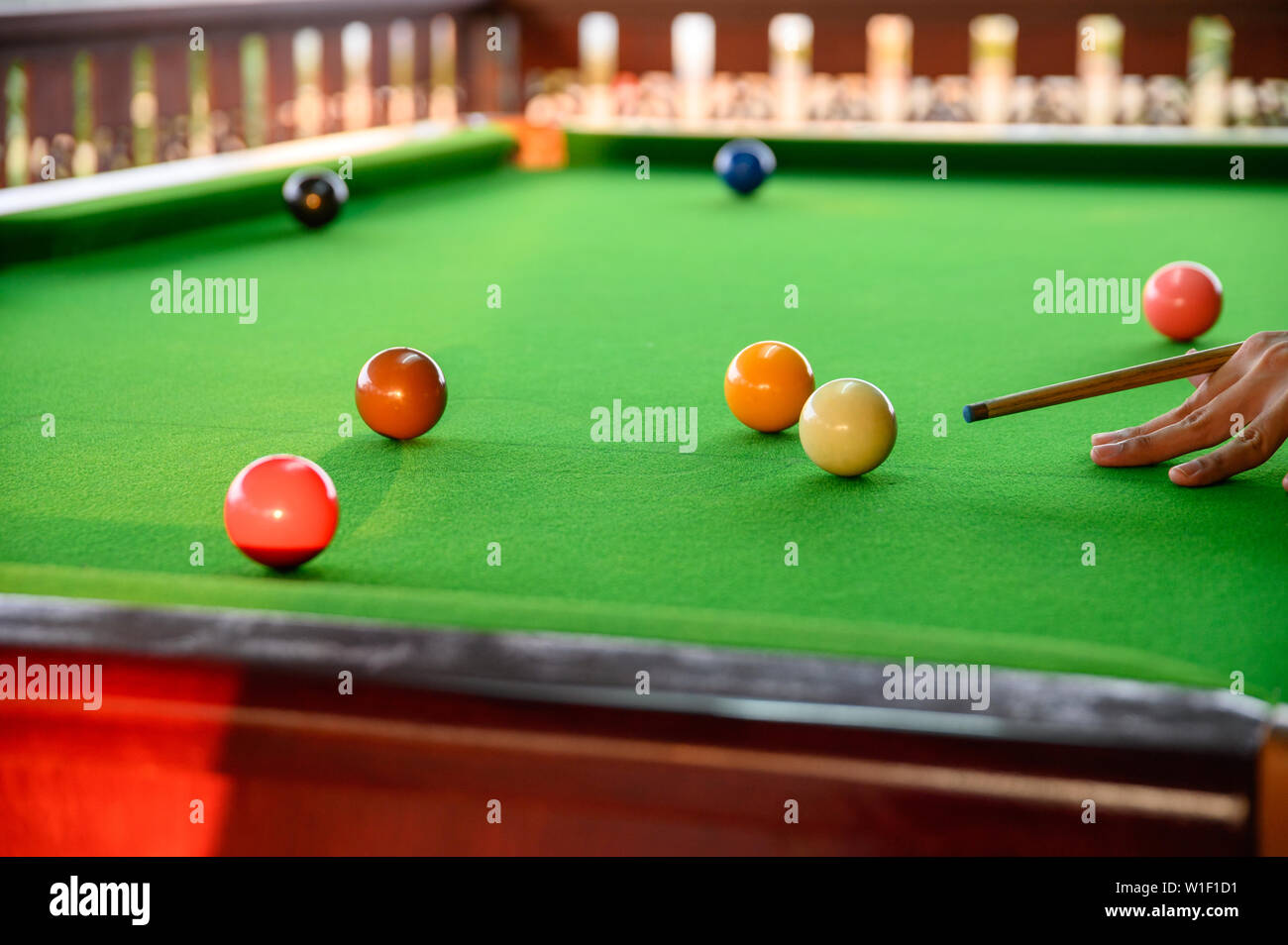 Man's hand playing snooker in bar with color snooker ball Stock Photo ...