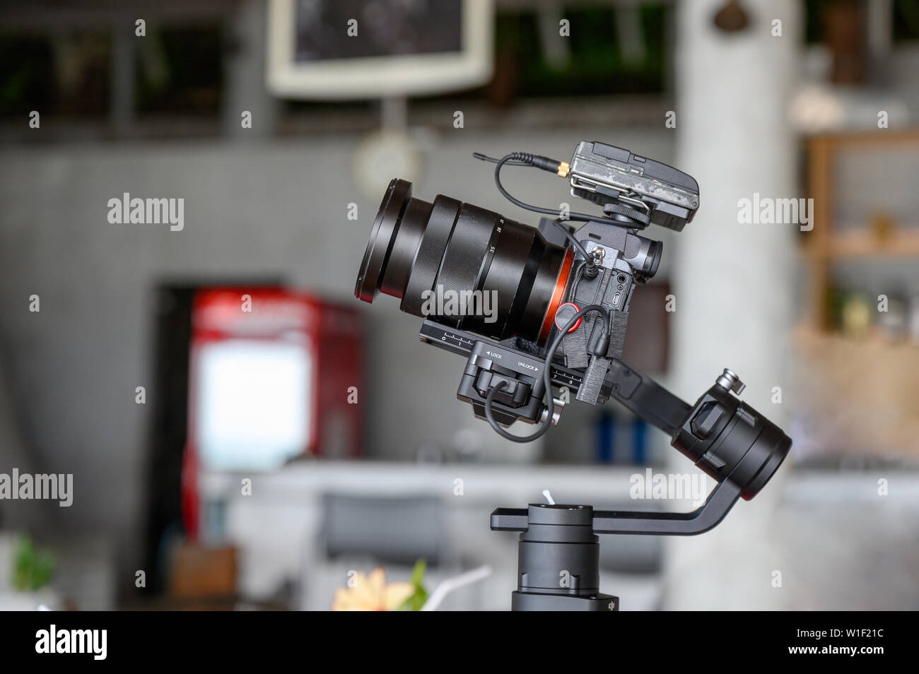 Mirrorless camera with mic wireless on gimbal stabilizer for filming Stock Photo