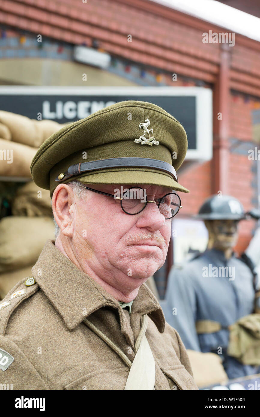 Kidderminster, UK. 29th June, 2019. Severn Valley Railways 'Step back to the 1940's' gets off to a fabulous start this summer weekend with costumed re-enactors playing their part in providing an authentic recreation of wartime Britiain. A Captain Mainwaring lookalike, in his WW2 Home Guard uniform, stands on duty at this heritage railway vintage station, looking rather serious! Credit: Lee Hudson Stock Photo