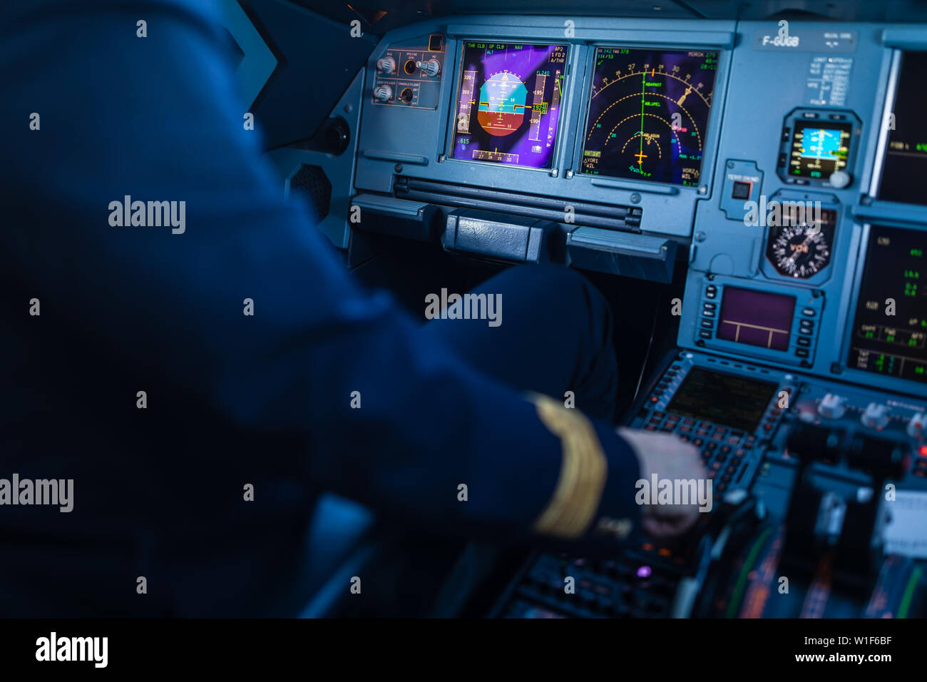 Pilot's hand accelerating on the throttle in a commercial airliner ...