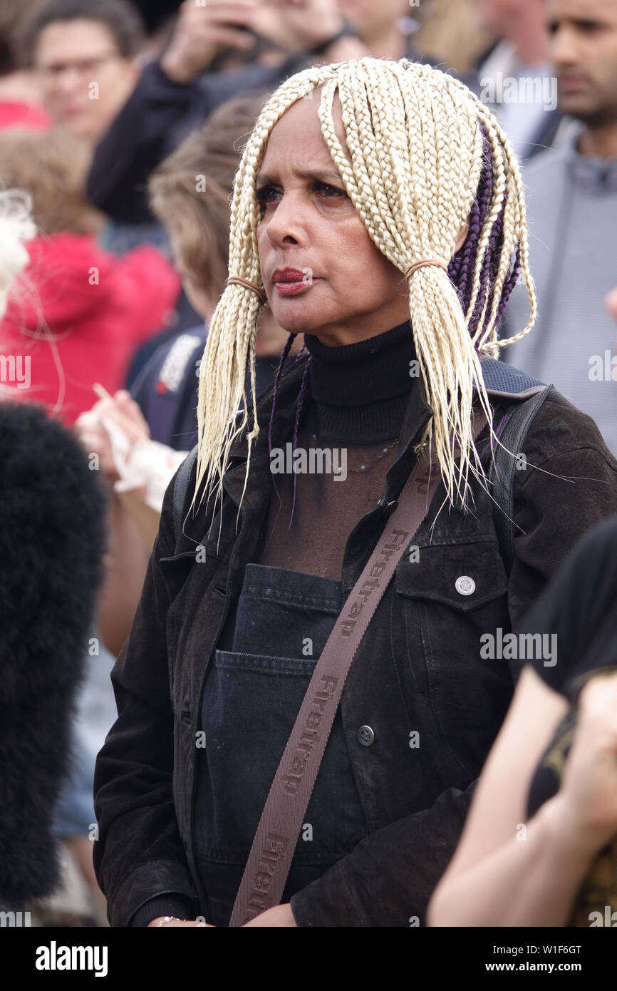 Woman with blond cornrow hairstyle in plaits at a music festival Stock Photo