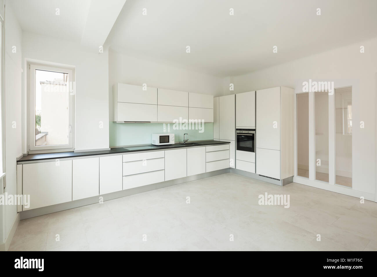 Interior of white modern kitchen, nobody inside Stock Photo