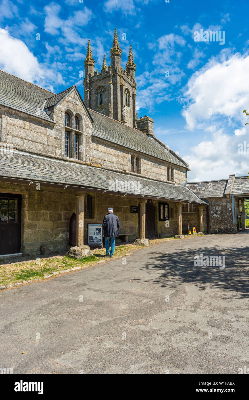 Sextons Cottage and Church House with St Pancras Church at Widecombe in the Moor village in Dartmoor National park, Devon, England, UK. Stock Photo