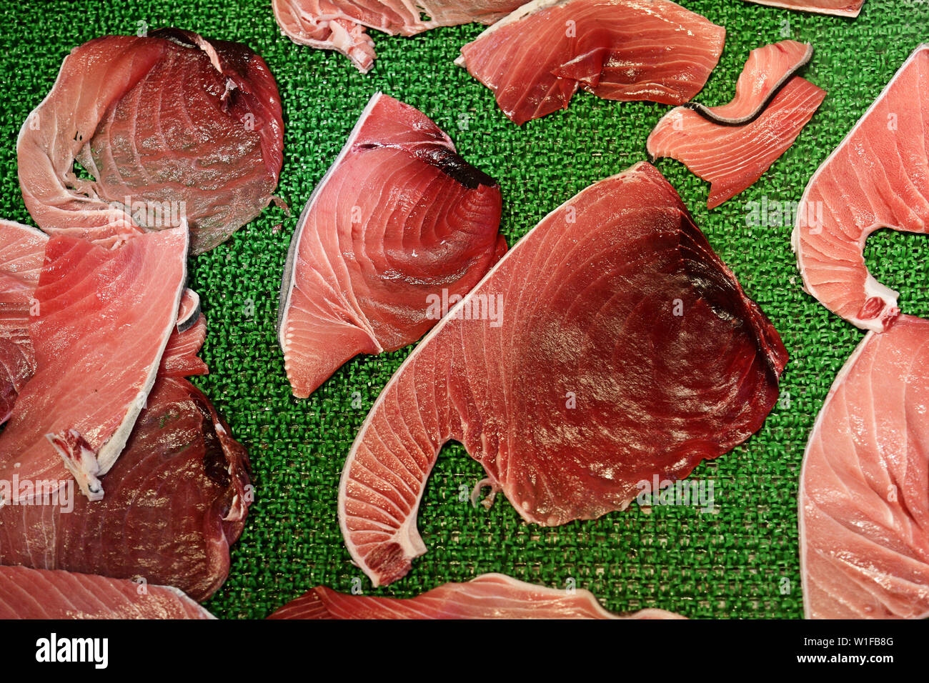 Raw tuna meat fillets or slices display in Tsukiji fish market, Tokyo