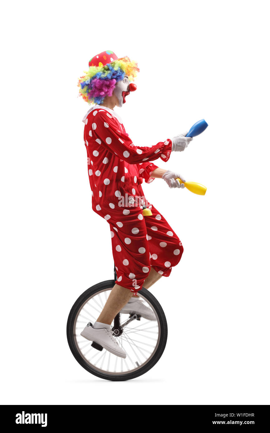 Juggling On A Unicycle Stock Photos & Juggling On A Unicycle Stock