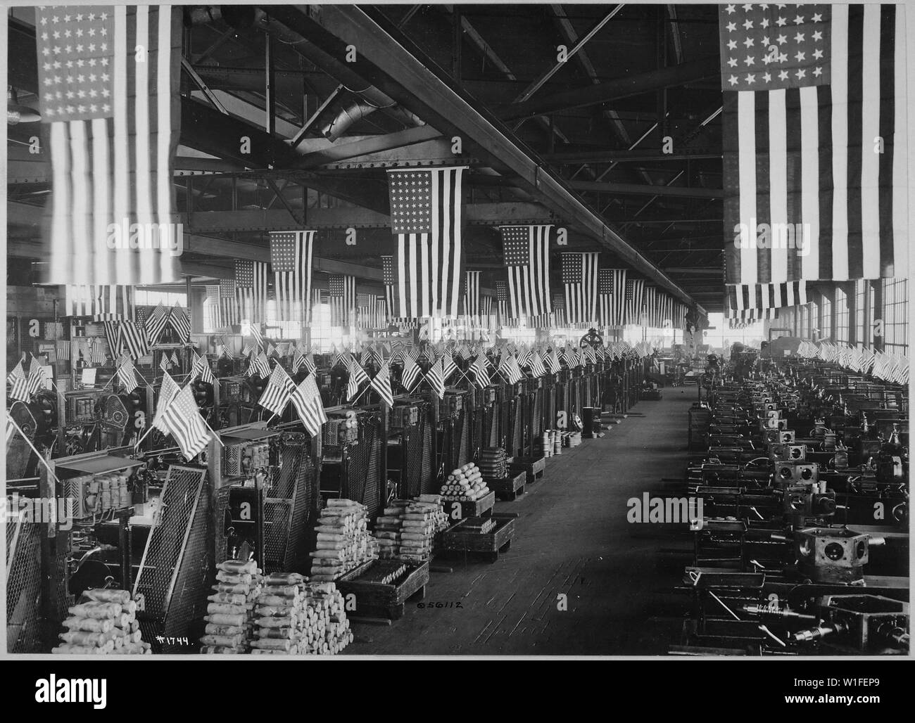 Interior view of projectile shop #1, machining 3 inch shells. Bethlehem Steel Company, Bethlehem, Pennsylvania. Bethlehem Steel Company., ca. 1918; General notes:  Use War and Conflict Number 556 when ordering a reproduction or requesting information about this image. Stock Photo