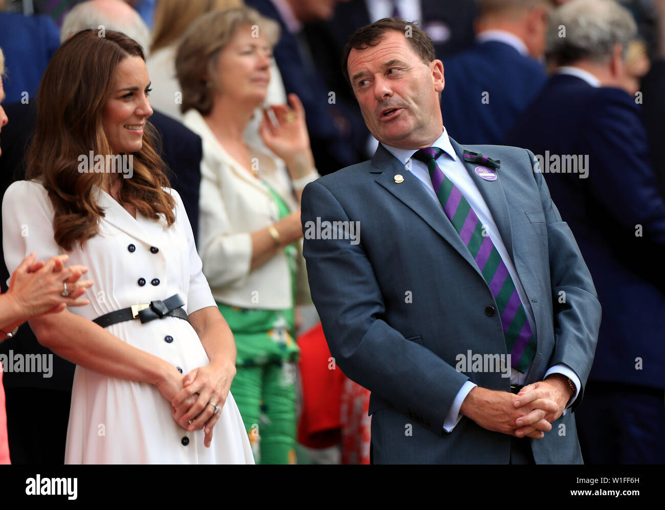 The Duchess of Cambridge and Chairman of the AELTC Philip Brook in the royal box of centre court on day two of the Wimbledon Championships at the All England Lawn Tennis and Croquet Club, Wimbledon. Stock Photo