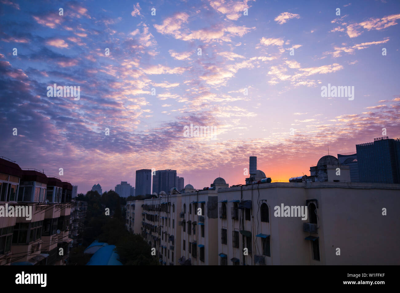 As a consequence of laziness, I missed the beautiful morning sky and had to took shot from my living room’s window with sleepy eyes… About 1 minites l Stock Photo