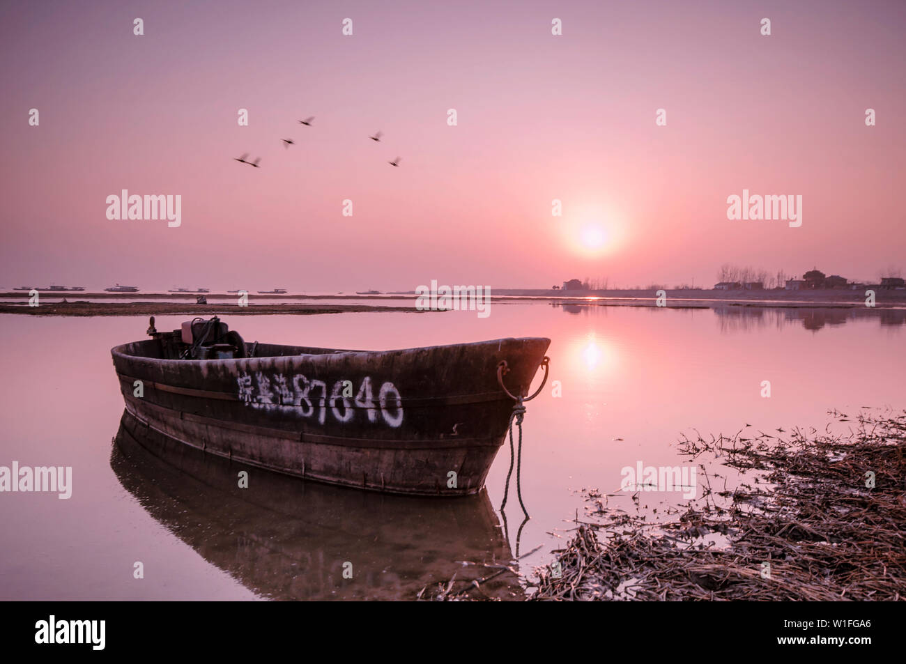 sunset sea reflection watercraft boat Stock Photo - Alamy