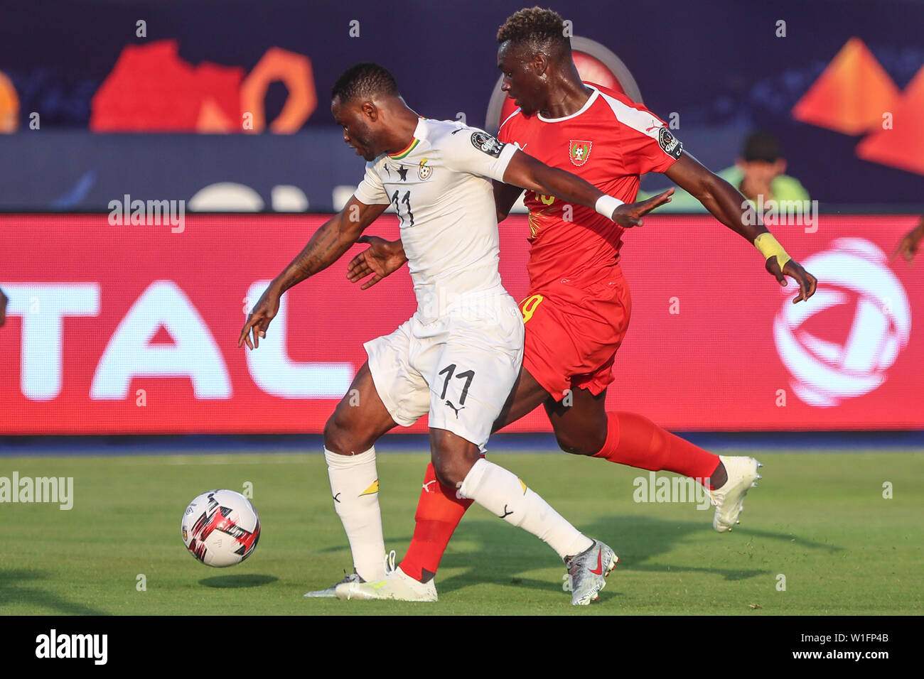 Suez, Egypt. 02nd July, 2019. Guinea-Bissau's Joseph Mendes and Ghana's Mubarak Wakaso battle for the ball during the 2019 Africa Cup of Nations Group F soccer match between Guinea-Bissau and Ghana at the Suez Stadium. Credit: Omar Zoheiry/dpa/Alamy Live News Stock Photo