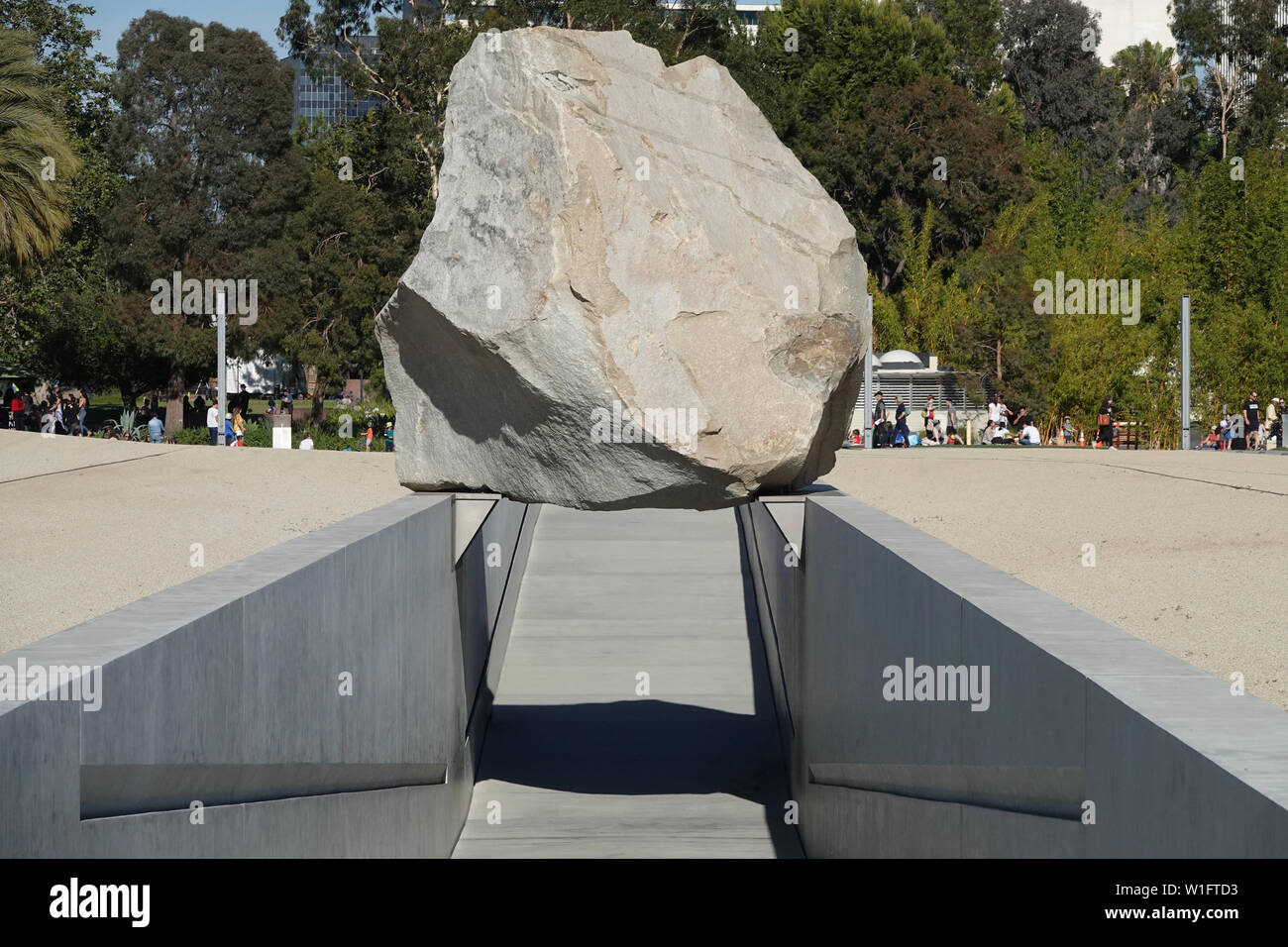 Los Angeles, CA / USA - June 28, 2019: The public art display, Levitated Mass, by Michael Heizer, is shown at the Los Angeles County Museum of Art. Stock Photo
