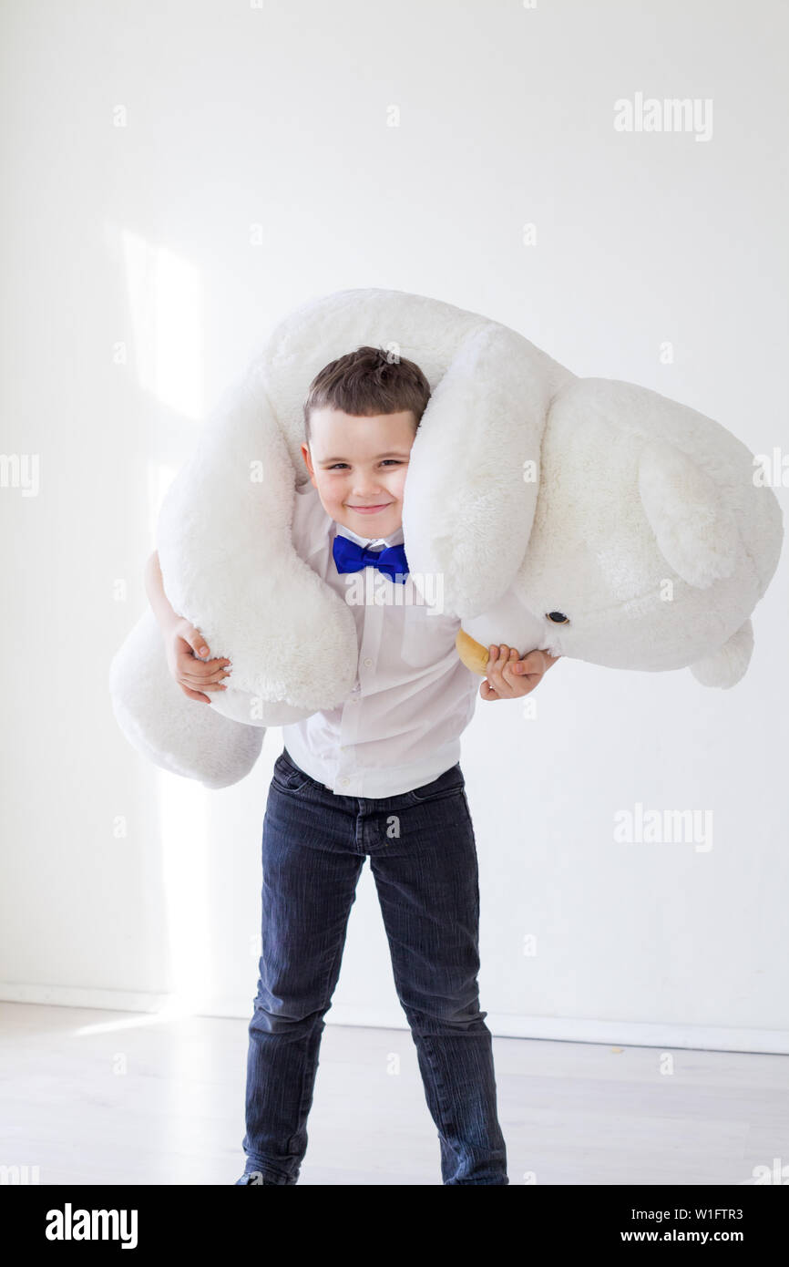 boy with a soft toy of a large bear Stock Photo - Alamy