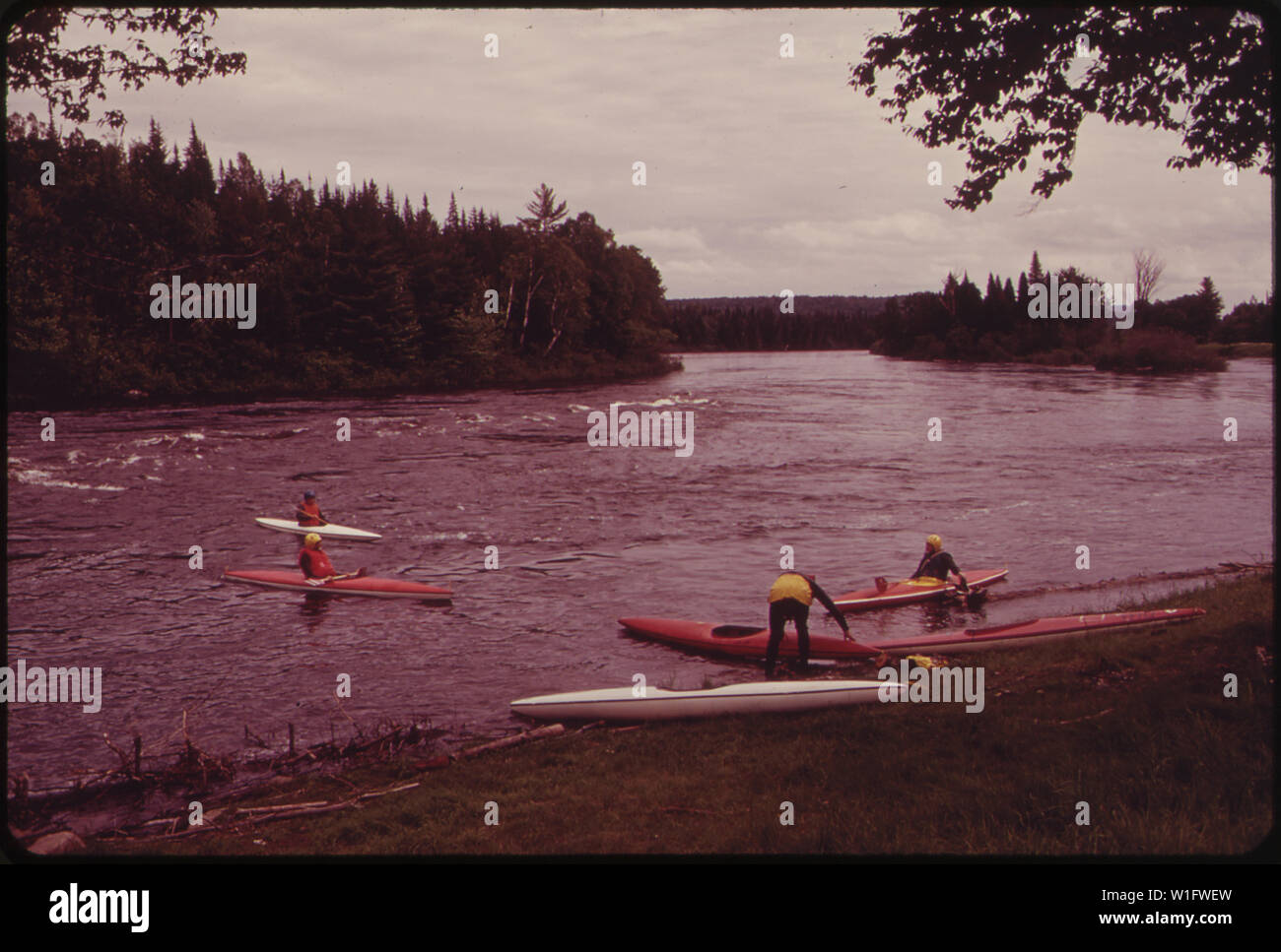 LAUNCHING KAYAKS INTO THE ANDROSCOGGIN RIVER BELOW THE ERROL BRIDGE