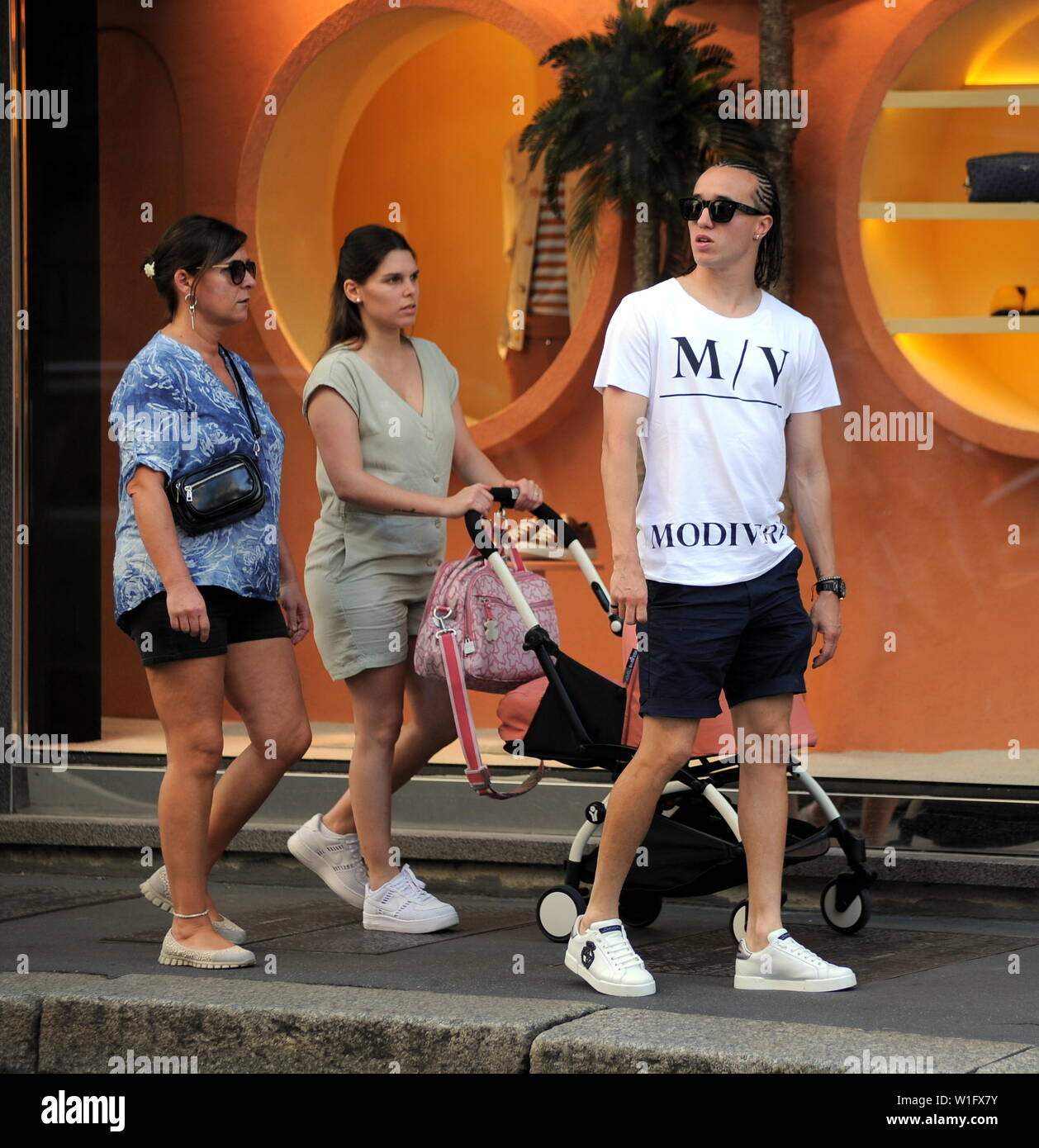 Milan, Diego Laxalt in the center with the whole family Diego Laxalt, Uruguayan footballer of Milan and of the URUGUAY national team, just returned from the America's Cup, enjoying a bit of relaxation. Here he is in the late afternoon walking through the streets of the center together with his wife ANTONELLA, the little JULIETA born only 1 month and a half ago, and the mother-in-law. Stock Photo