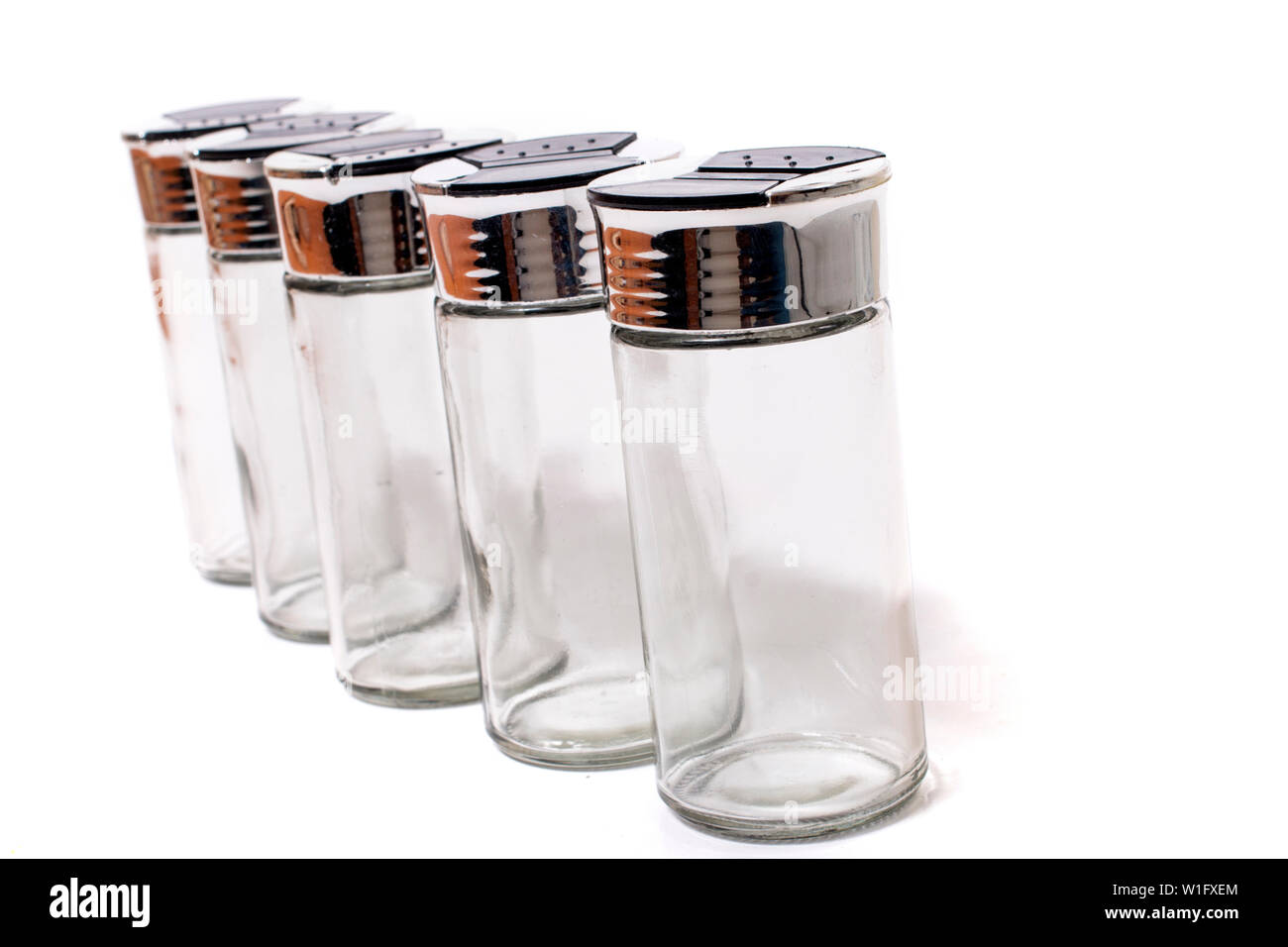 empty spice jars isolated on a white background Stock Photo - Alamy