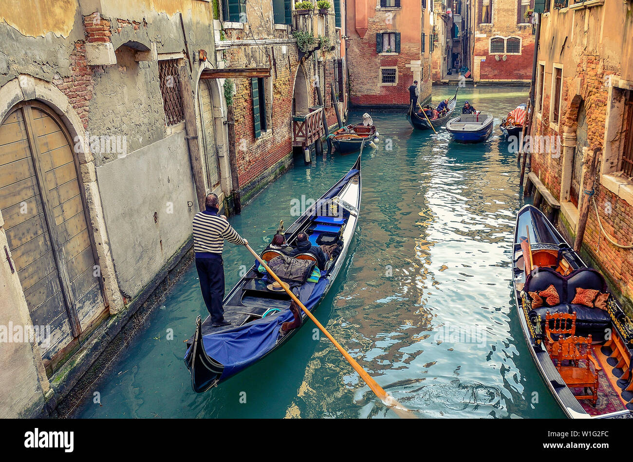 Representative images for Venice. On their gorgeous canals, tourists walk in boats led by experienced, younger, older people, who love to tell about t Stock Photo
