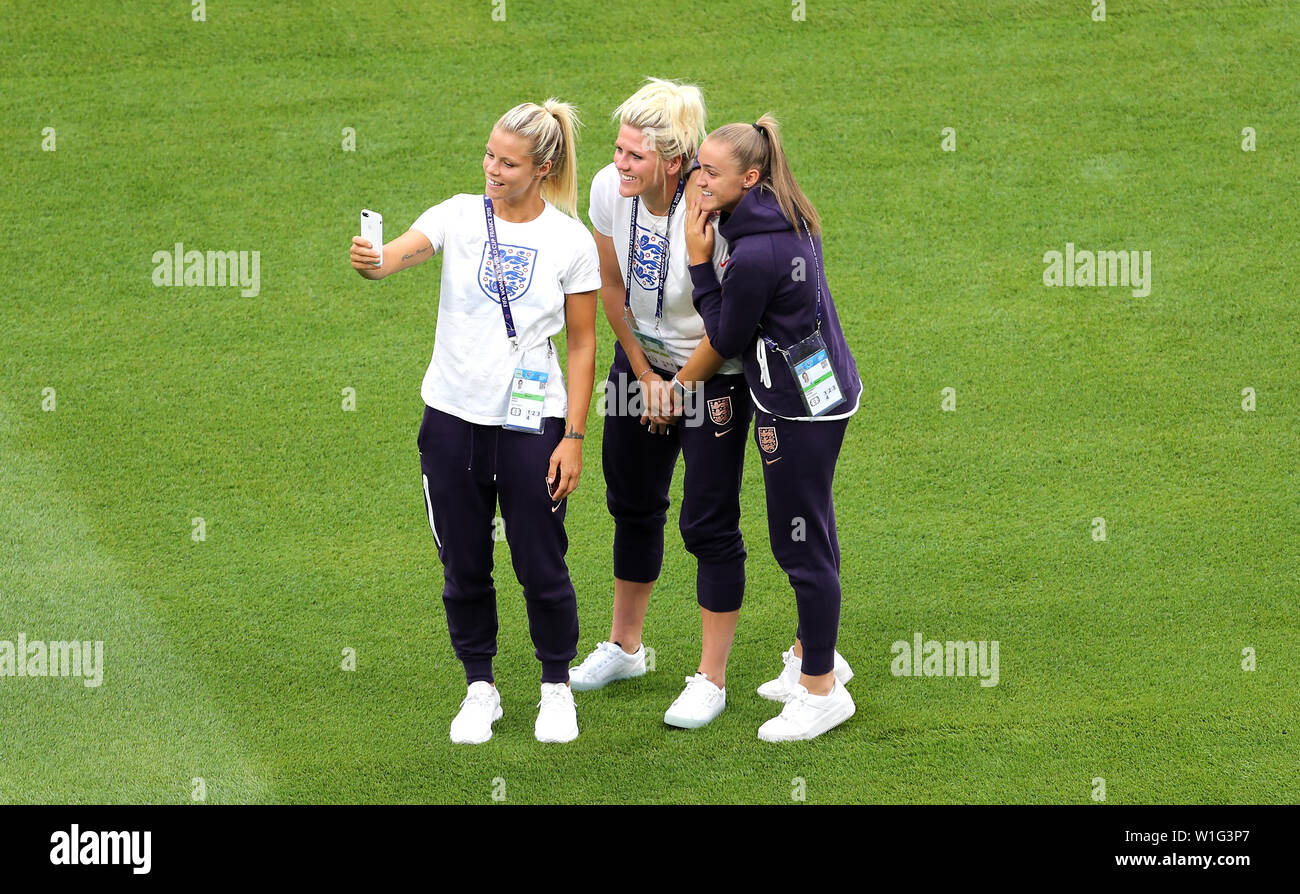 England's Rachel Daly, Millie Bright and Georgia Stanway take a selfie on the pitch prior to the FIFA Women's World Cup Semi Final match at the Stade de Lyon. Stock Photo