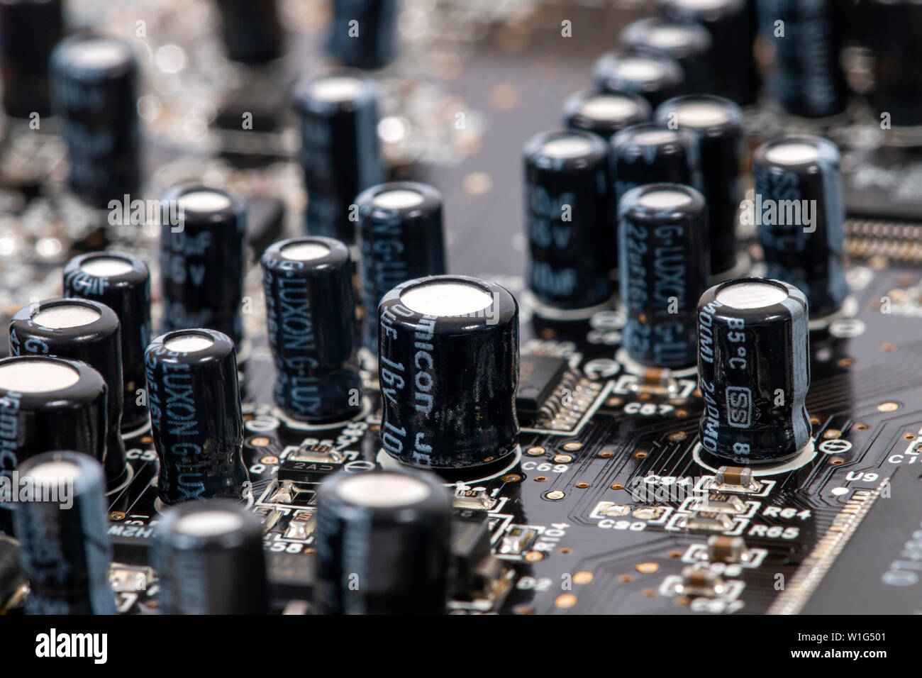 Close view of the main computer circuit board capacitors Stock Photo