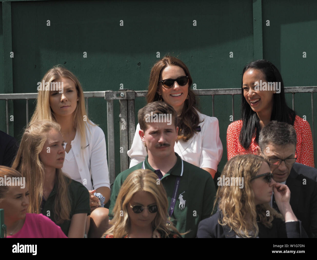 London, UK. 02nd July, 2019. LONDON, ENGLAND - JULY 02: Catherine, Duchess of Cambridge and Anne Keothavong (R) smile as they attend day 2 of the Wimbledon Tennis Championships at the All England Lawn Tennis and Croquet Club on July 02, 2019 in London, England People: Catherine, Duchess of Cambridge, Anne Keothavong Credit: Storms Media Group/Alamy Live News Stock Photo