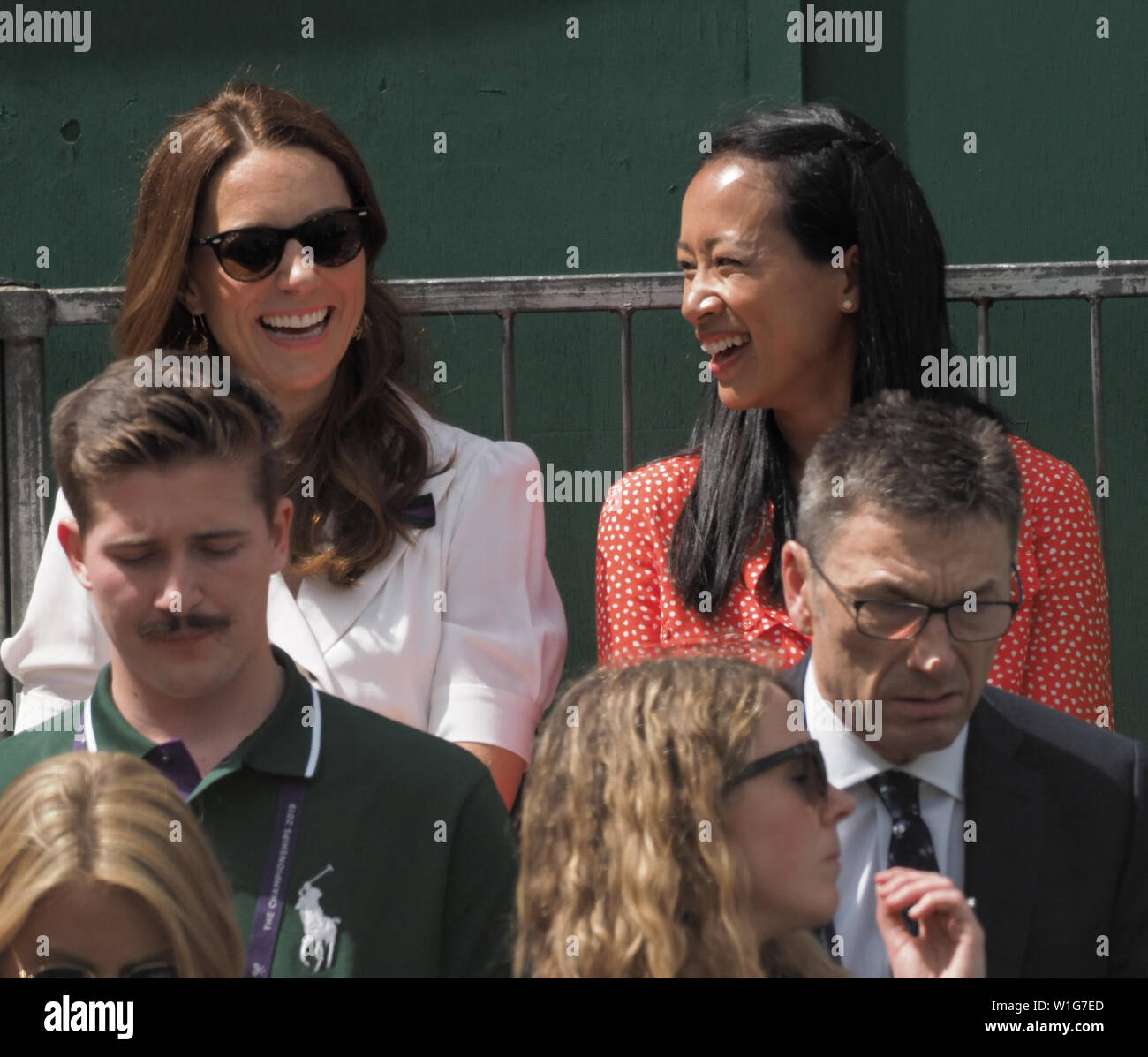 London, UK. 02nd July, 2019. LONDON, ENGLAND - JULY 02: Catherine, Duchess of Cambridge and Anne Keothavong (R) smile as they attend day 2 of the Wimbledon Tennis Championships at the All England Lawn Tennis and Croquet Club on July 02, 2019 in London, England People: Catherine, Duchess of Cambridge, Anne Keothavong Credit: Storms Media Group/Alamy Live News Stock Photo