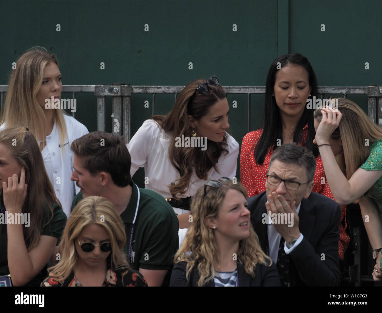 London, UK. 02nd July, 2019. LONDON, ENGLAND - JULY 02: Catherine, Duchess of Cambridge and Anne Keothavong (R) smile as they attend day 2 of the Wimbledon Tennis Championships at the All England Lawn Tennis and Croquet Club on July 02, 2019 in London, England People: Catherine, Duchess of Cambridge, Anne Keothavong Credit: Storms Media Group/Alamy Live News Stock Photo
