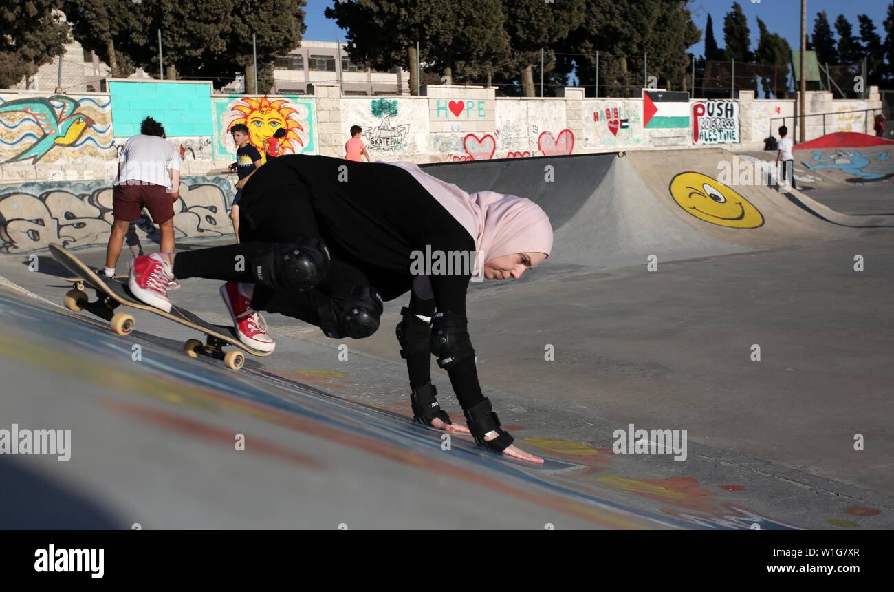 July 2, 2019 - Nablus, West Bank, Palestinian Territory - A Palestinian  girl skateboards in a skatepark in the village of Asira ash-Shamaliya, near  the West Bank city of Nablus, July 02,