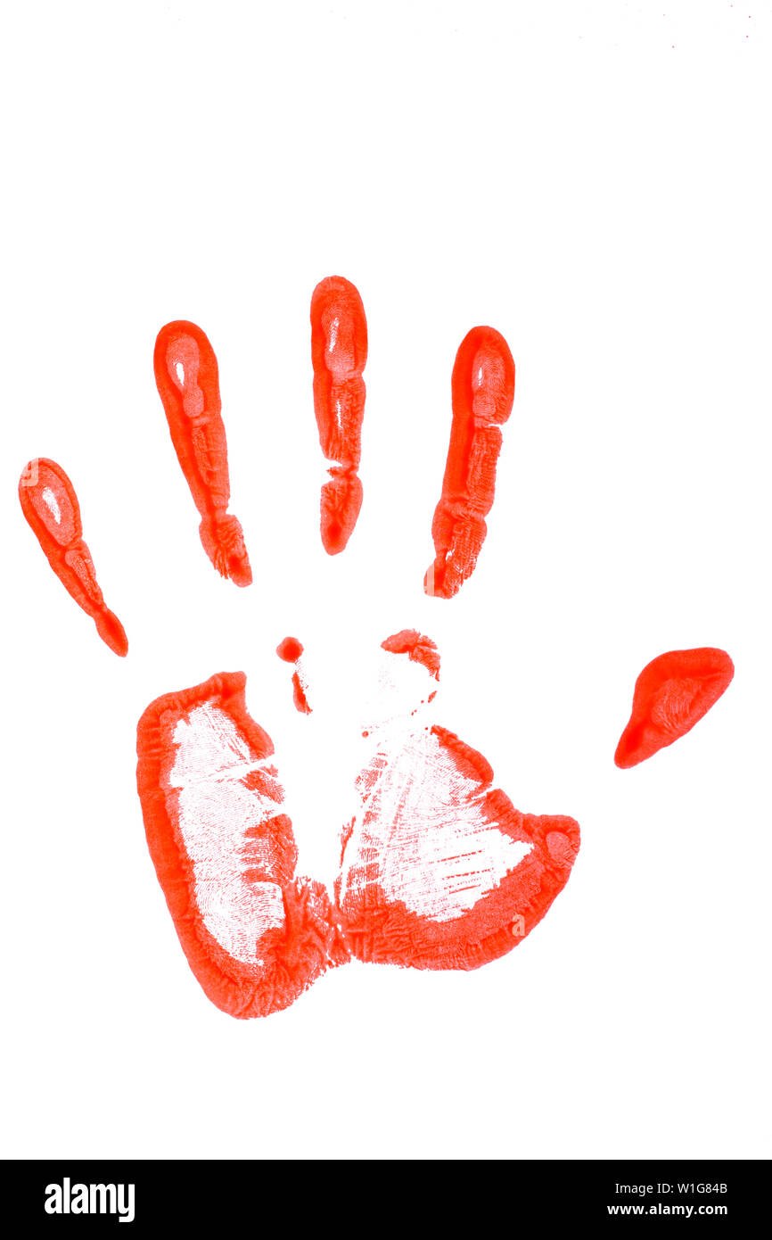 Close up view of a hand print on red spray paint. Stock Photo