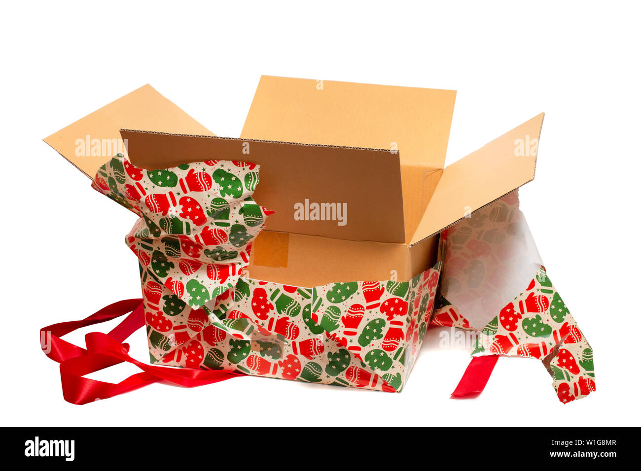 Beatifully wrapped present being unwrapped isolated on a white background. Stock Photo