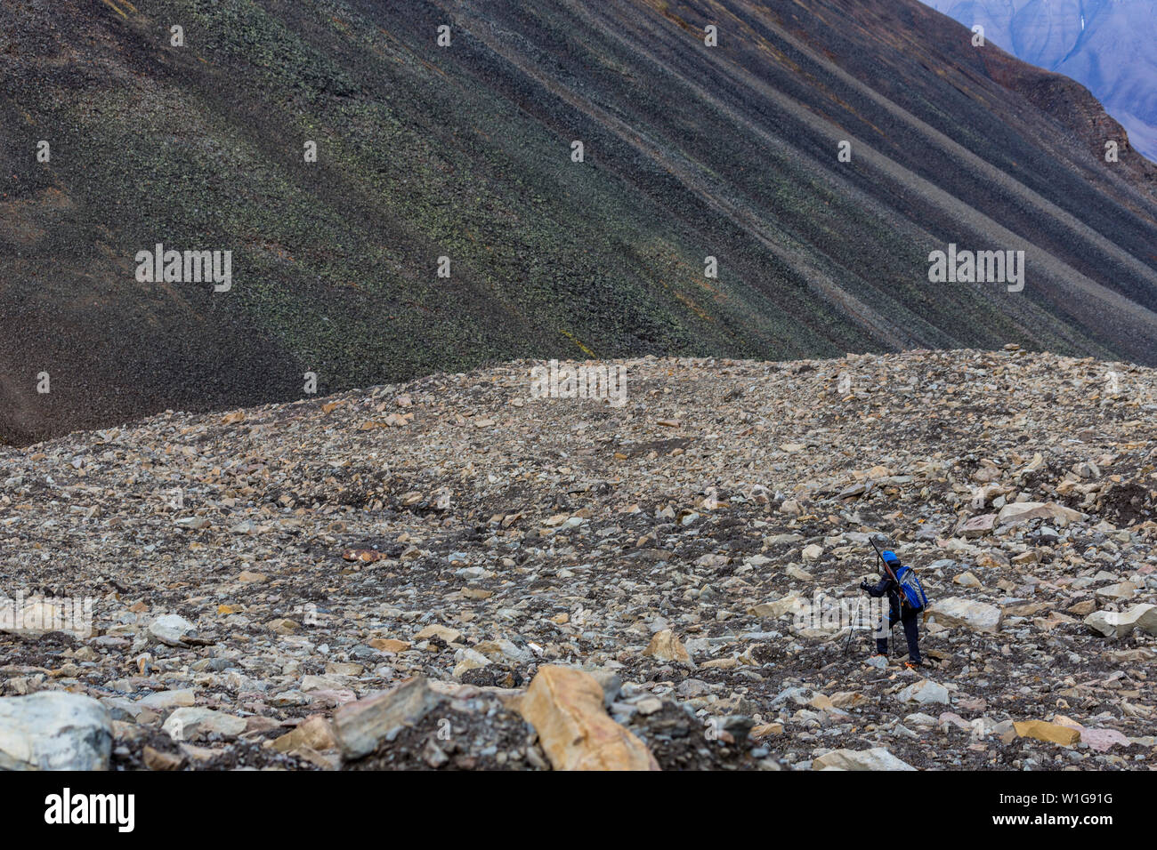 Hiker on top of the Longyear glacier. Svalbard, Norway Stock Photo