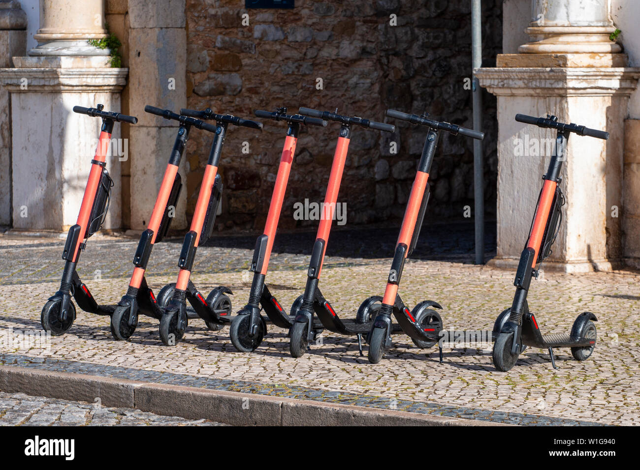 Electric scooters in row on the streets, a modern city bike rental system,  located in Faro, Portugal Stock Photo - Alamy