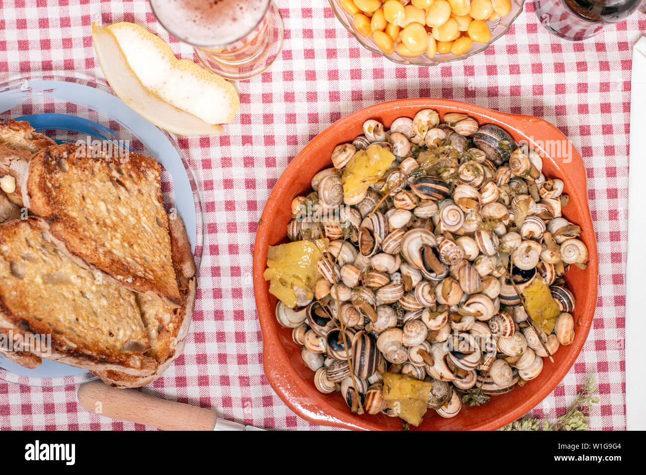 Traditional Portuguese dish of cooked snails and toasted bread and beer