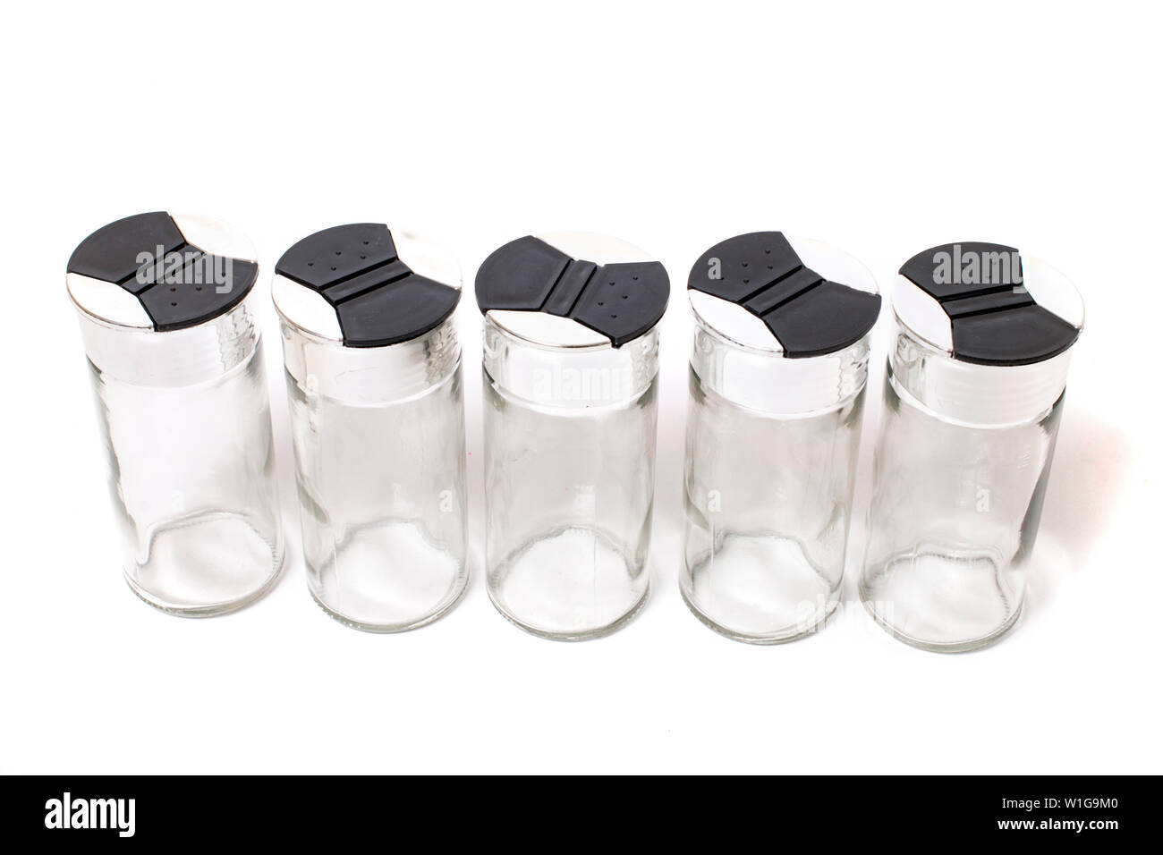 empty spice jars isolated on a white background Stock Photo - Alamy