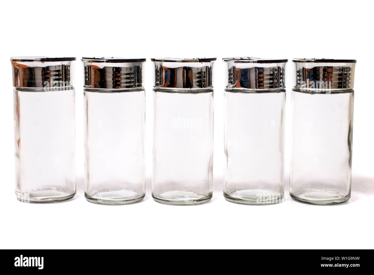 empty spice jars isolated on a white background Stock Photo - Alamy