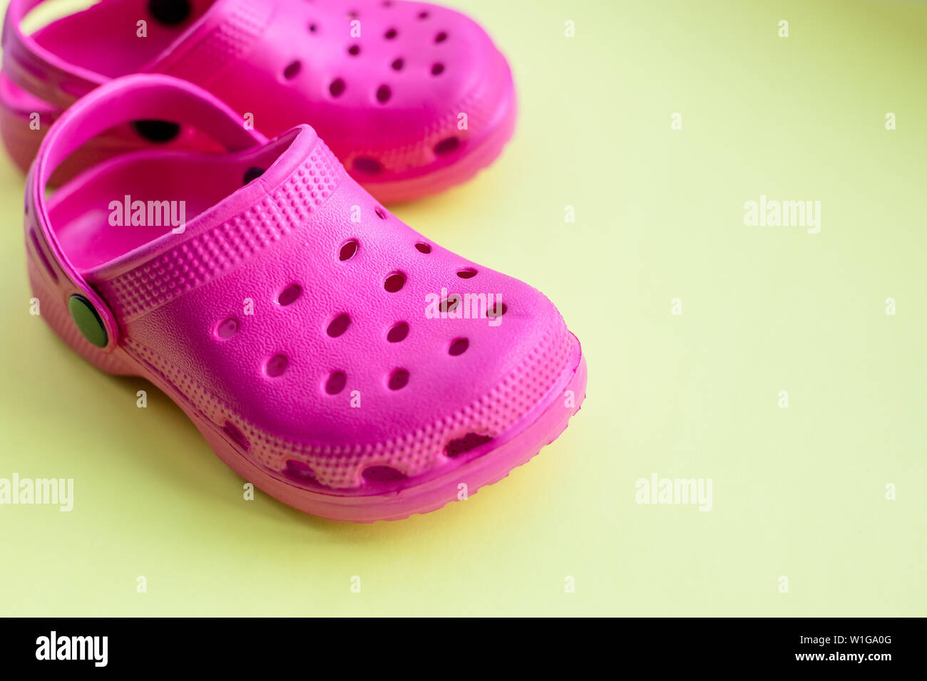 Yellow crocs shoes hi-res stock photography and images - Alamy