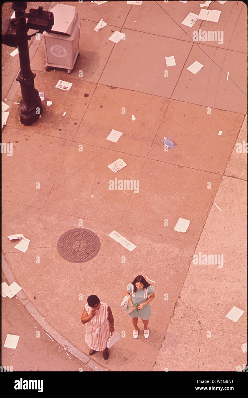 MAGAZINES AND NEWSPAPERS LITTER THE INTERSECTION OF SIXTH & BROADWAY