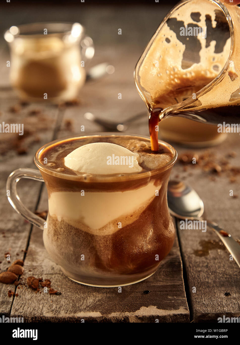 Iced coffee in tall glass. One sweet cold latte with whipped cream, with  chemex coffee maker on dark brown background copy space Stock Photo - Alamy