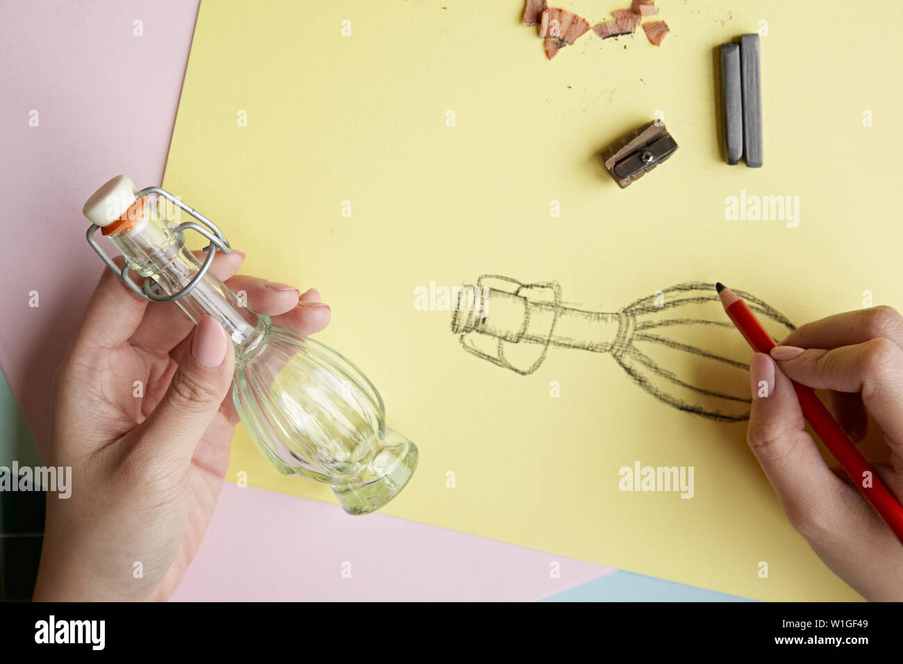 Hands drawing glass bottle Stock Photo